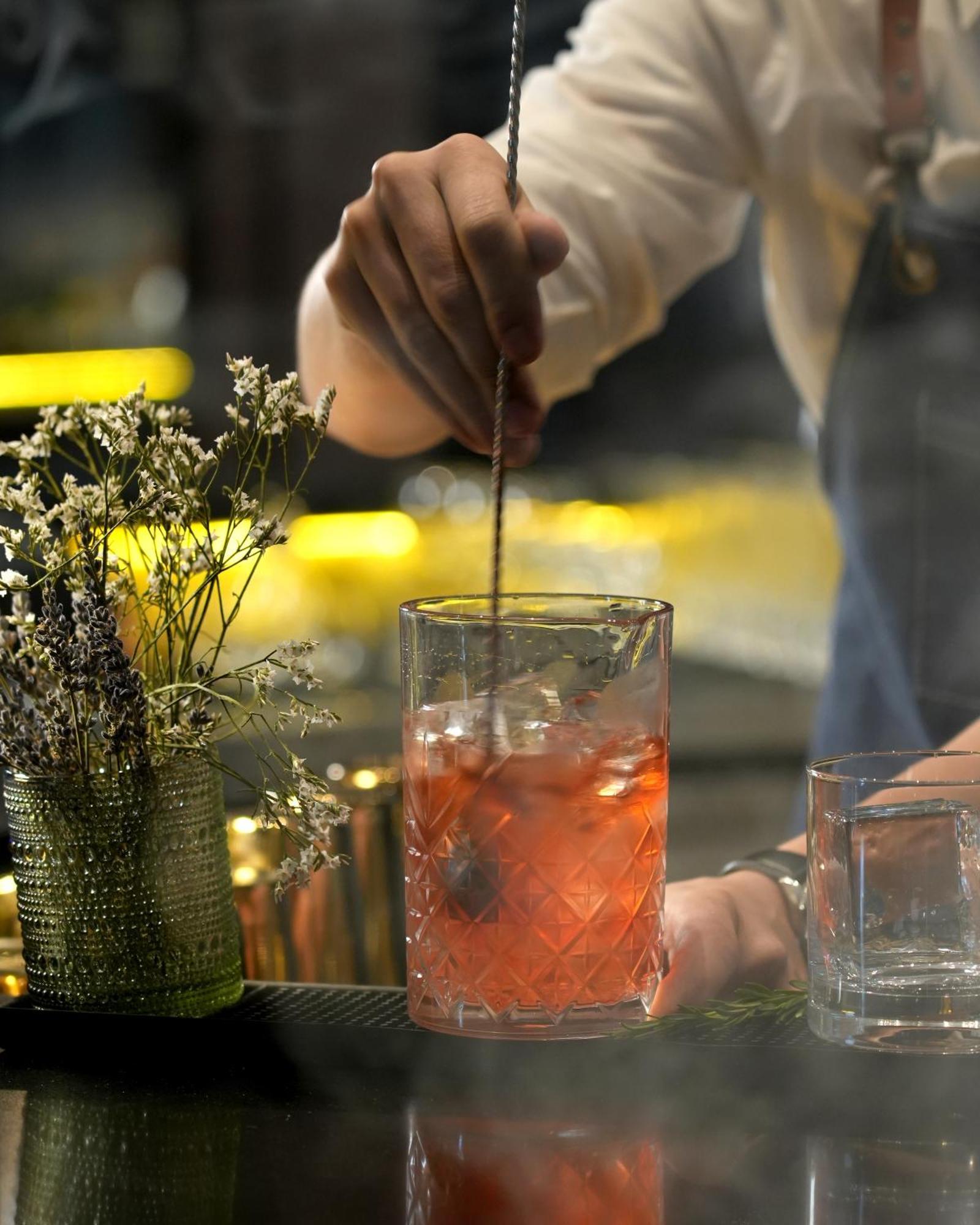 Fairmont Riyadh Luaran gambar A bartender stirring a cocktail